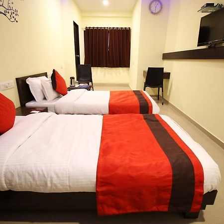 Hotel Ambience Sarkhej Bagian luar foto